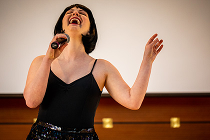 Woman singing at Theater Philadelphia Event