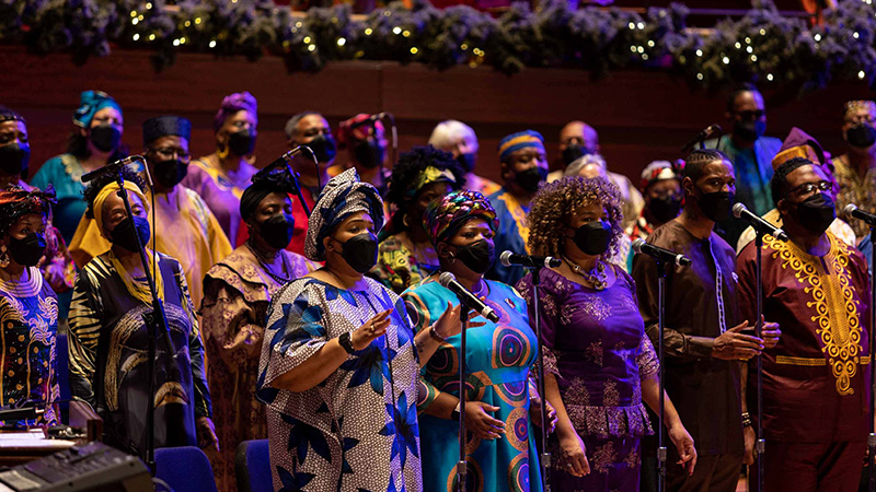 A choir performing on stage for A Soulful Christmas 