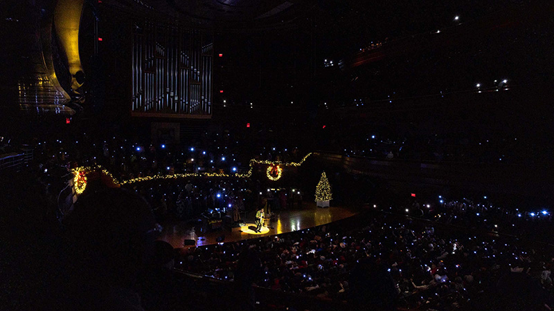 Wide view of a choir performing on stage for A Soulful Christmas 