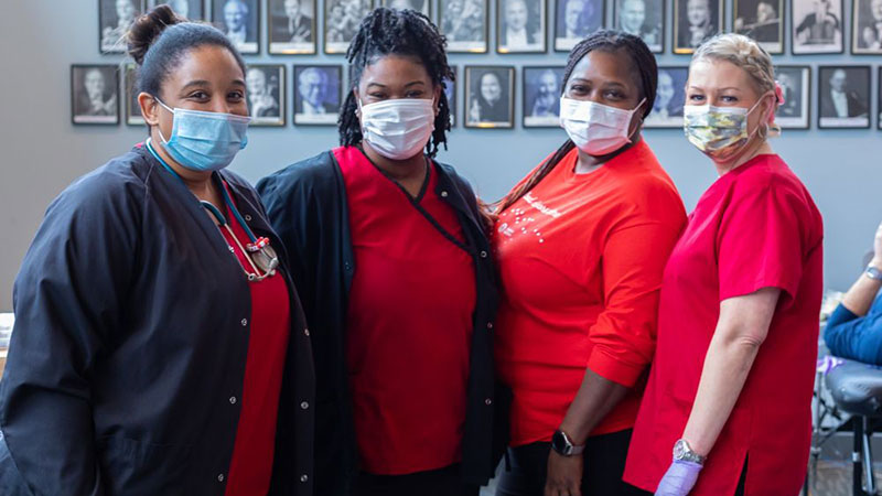 4 American Red Cross Workers Stand Masked