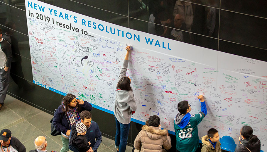 GUests write on the New Years Resolution wall inside the Kimmel Center on New Years Day
