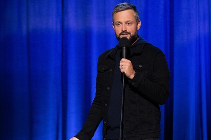 Nate Bargatze standing on stage