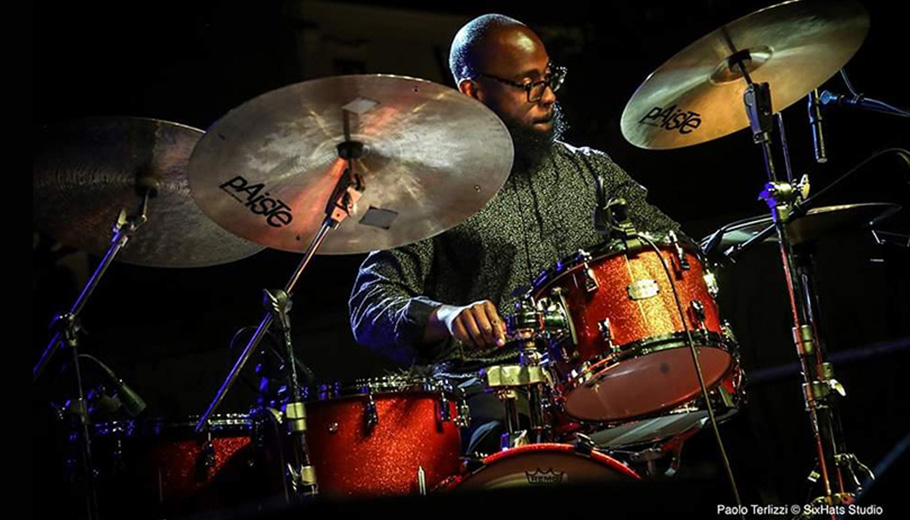 Musician Anwar Marshall playing the drums.