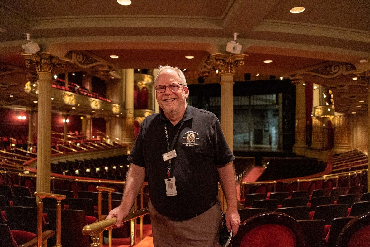 Frank Flood, Venue Manager at the Academy of Music in Philadelphia, stands at the top of the stairs with the house and stage behind him