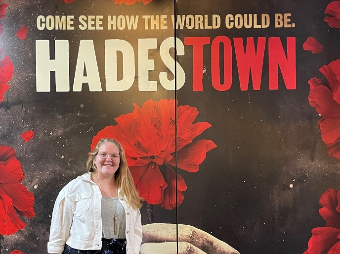 Morgan Horell stands before the Hadestown stage doors at the Walter Kerr in New York City