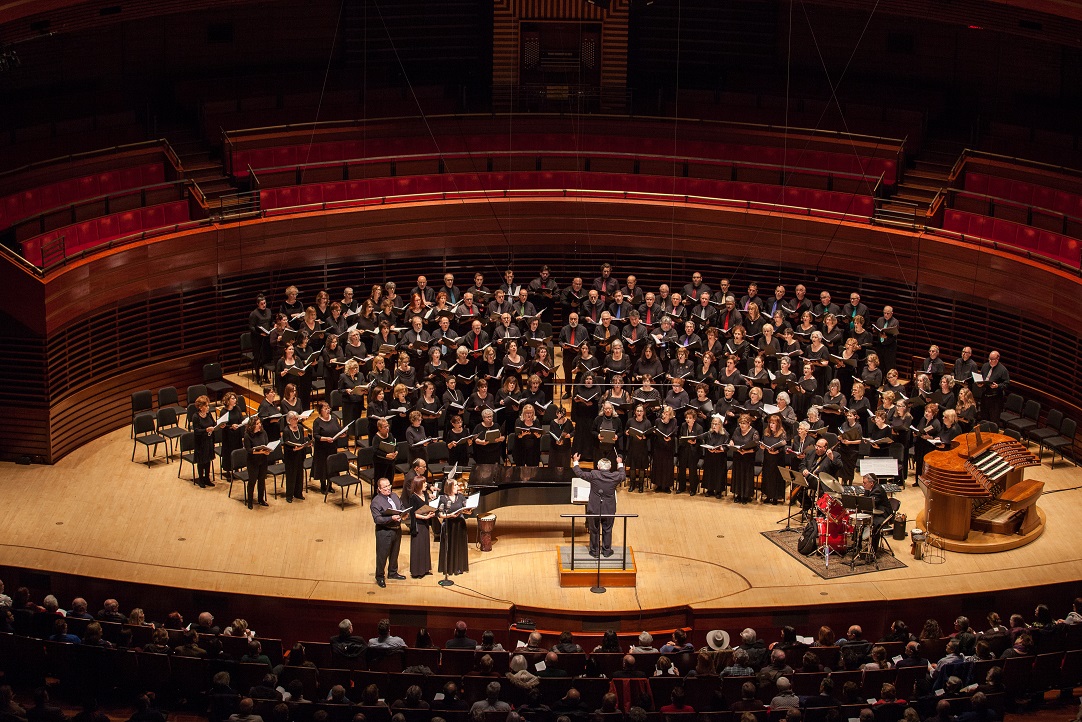 A group of Jewish choirs sing on stage in Verizon Hall