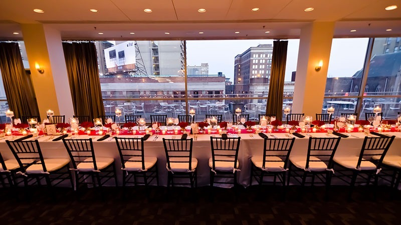 A dining table is set for guests to enjoy an amazing evening after a long day of professional events.